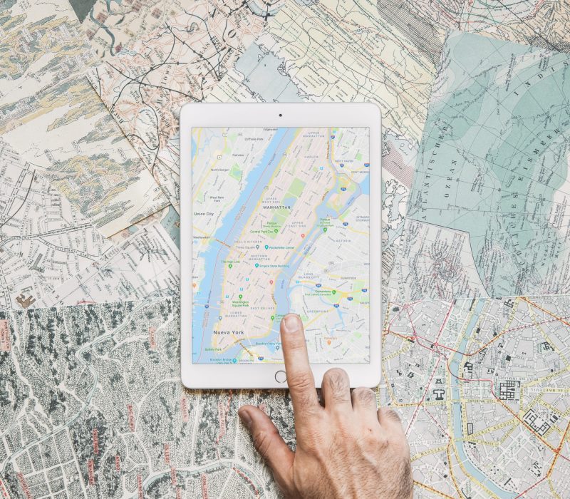 hand-tapping-tablet-with-map